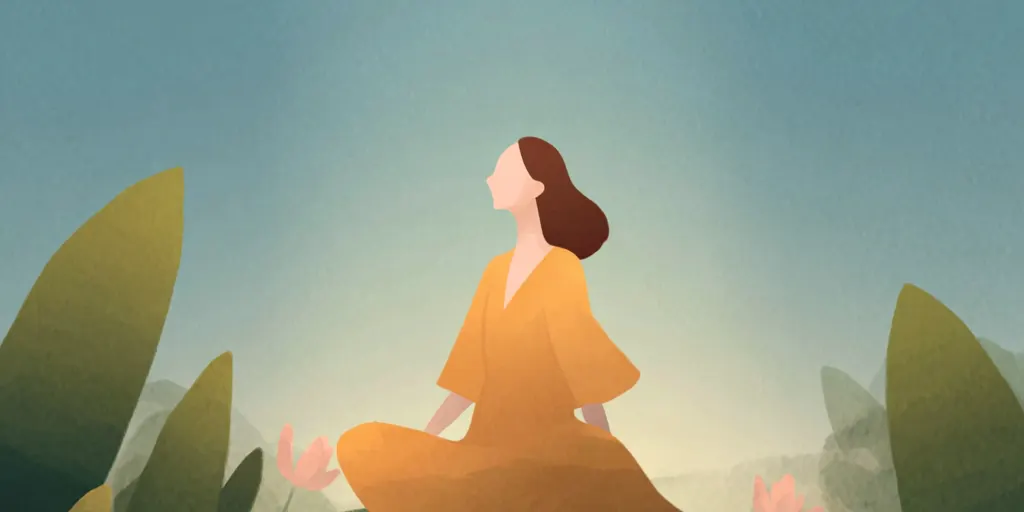A person sits in quiet meditation on a rock beside calm water at dusk.