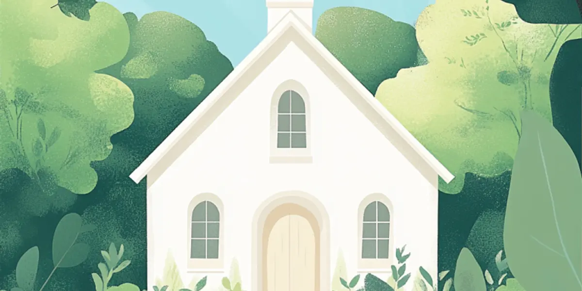 A small white country chapel with a cross sits framed by lush green trees under a soft morning sky.
